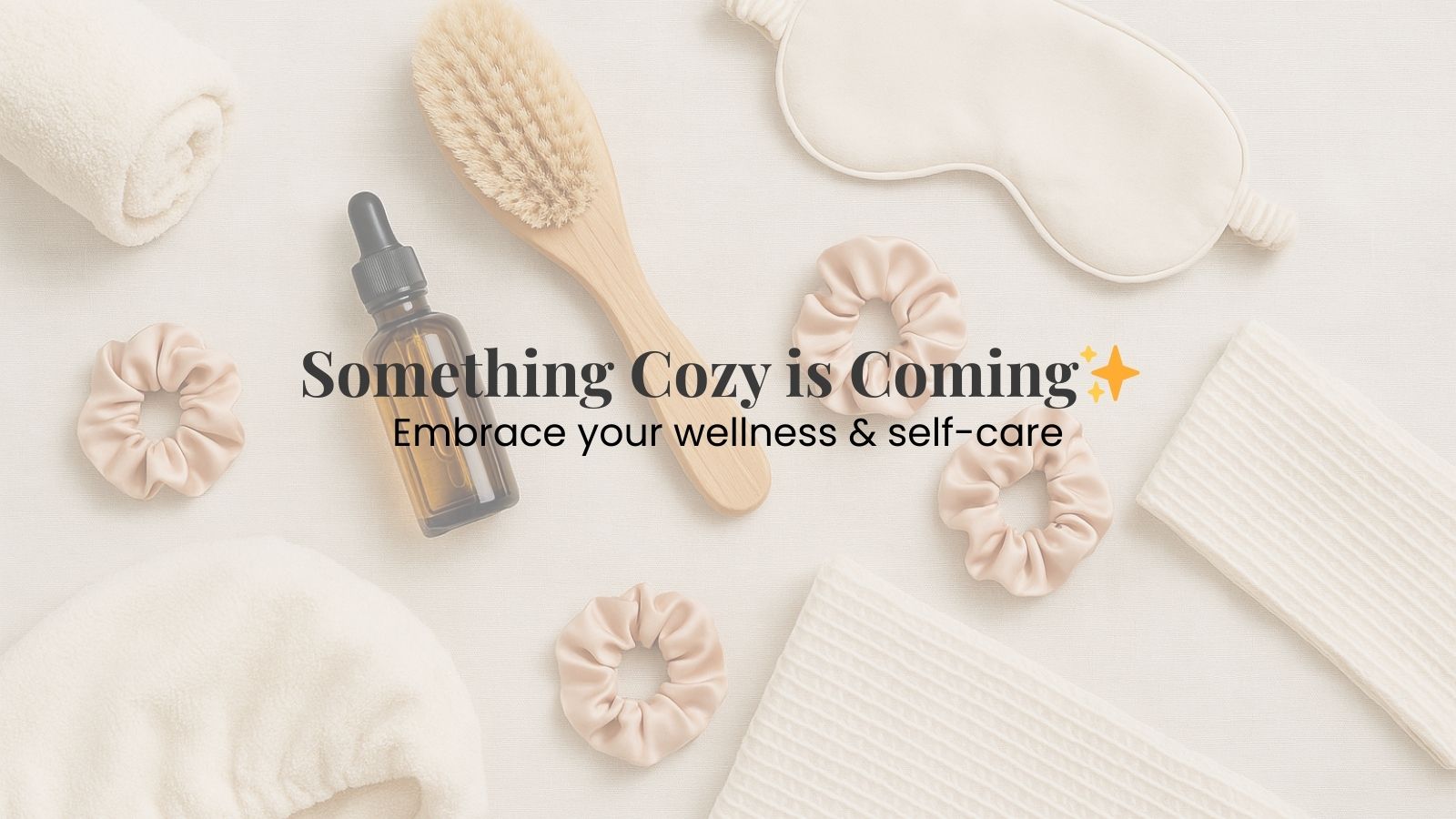 River & Hearth banner with text that reads ‘Something Cozy is Coming Soon, Embrace your wellness & self-care’ over a flatlay of self-care items including a hair towel, silk eye mask, scrunchies, and natural wellness accessories on a linen background.